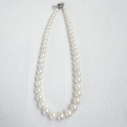 Close-up of an Akoya pearl necklace featuring 8-8.5mm white pearls on a 40cm strand