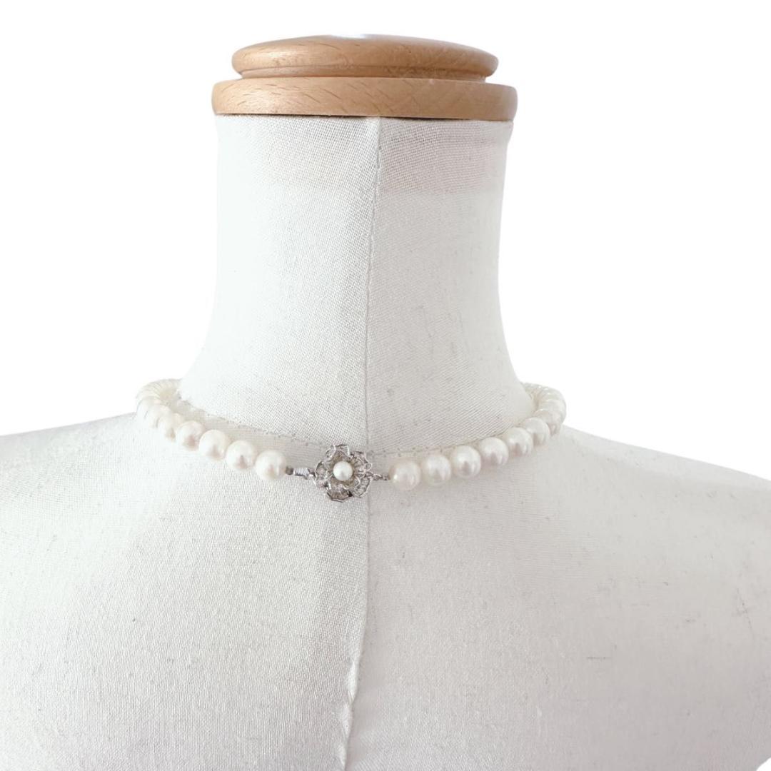 Close-up of an Akoya pearl necklace featuring 8-8.5mm white pearls on a 40cm strand