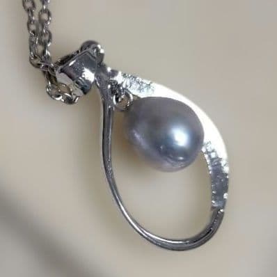 Mikimoto silver pendant necklace with a single 6mm pearl on a delicate chain