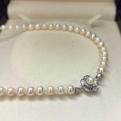 Akoya pearl necklace with white pearls 6.5-7mm diameter, 42cm length, displayed on a white background