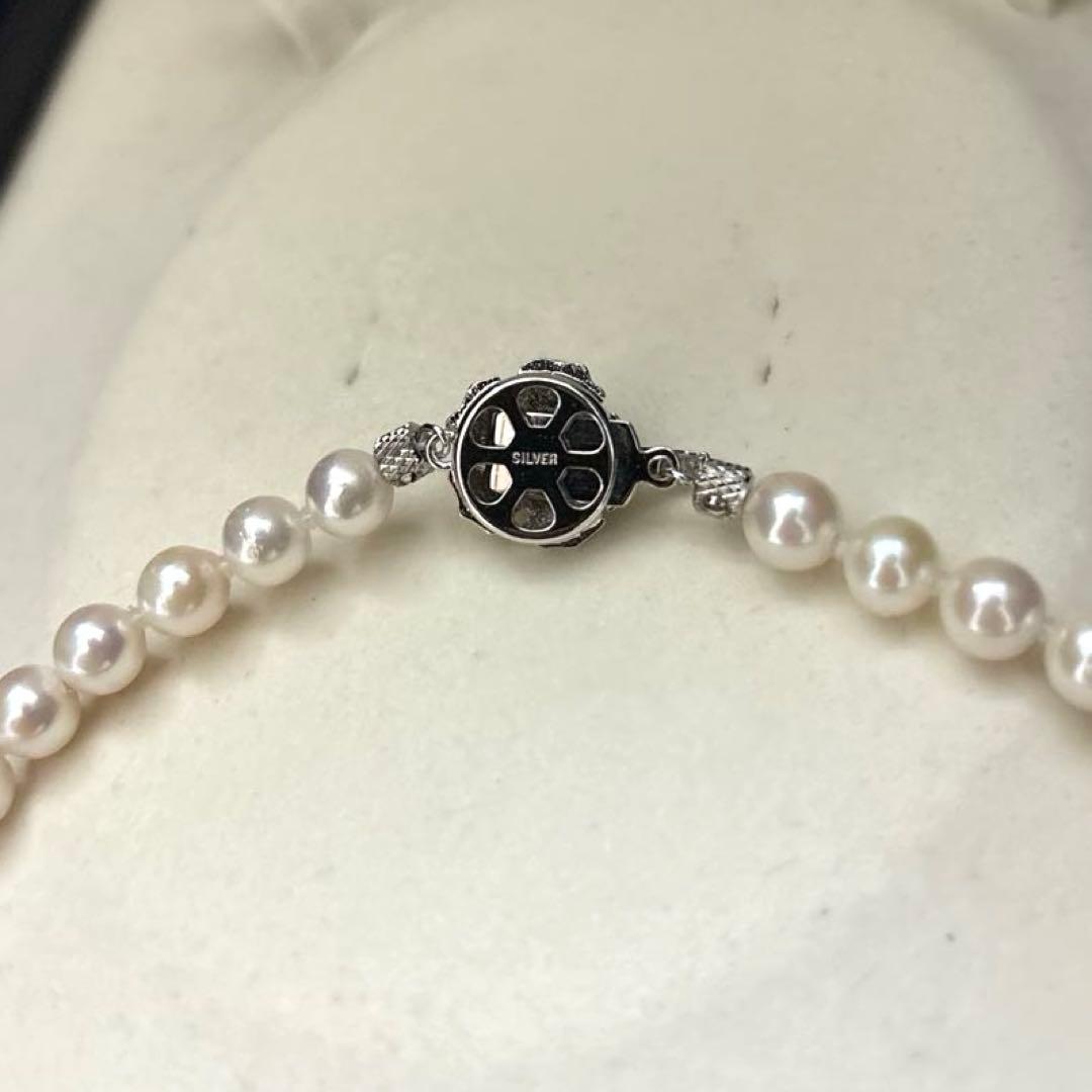 Akoya pearl necklace with white pearls 6.5-7mm diameter, 42cm length, displayed on a white background