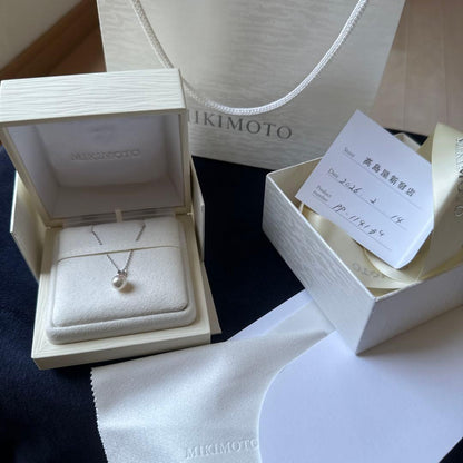 Mikimoto pearl pendant necklace with 7.5mm pearl set in 18K white gold chain