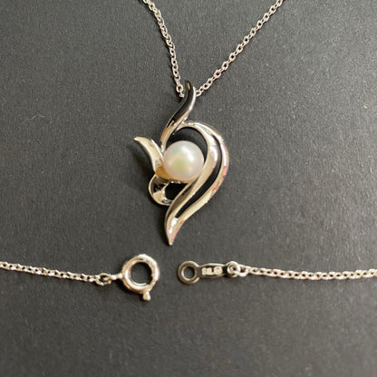 Akoya pearl necklace with a single 6.2mm pearl on a 40cm flowing curve silver chain