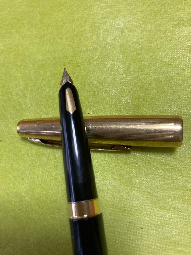 Pilot fountain pen with 14k gold nib in black and gold finish, 13.5 cm long