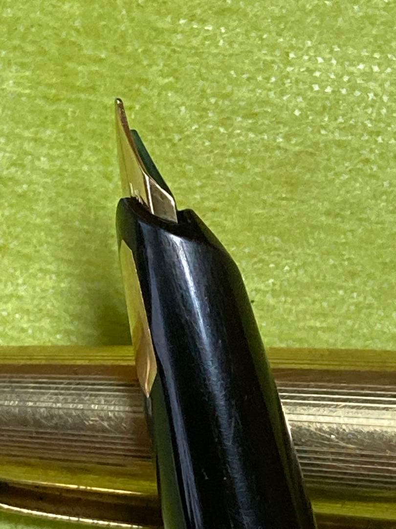 Pilot fountain pen with 14k gold nib in black and gold finish, 13.5 cm long