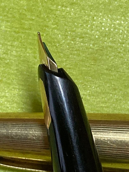 Pilot fountain pen with 14k gold nib in black and gold finish, 13.5 cm long