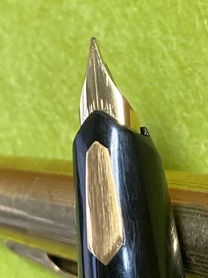 Pilot fountain pen with 14k gold nib in black and gold finish, 13.5 cm long