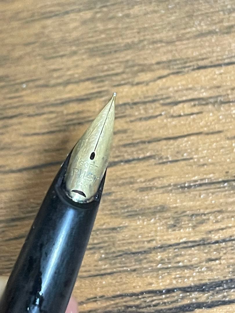 Pilot Fountain Pen E in black with gold trim featuring a soft inset nib