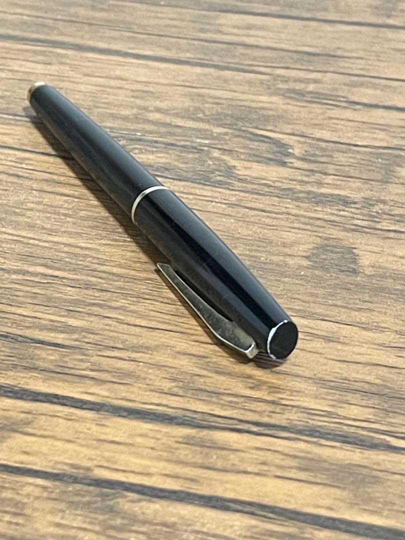 Pilot Fountain Pen E in black with gold trim featuring a soft inset nib