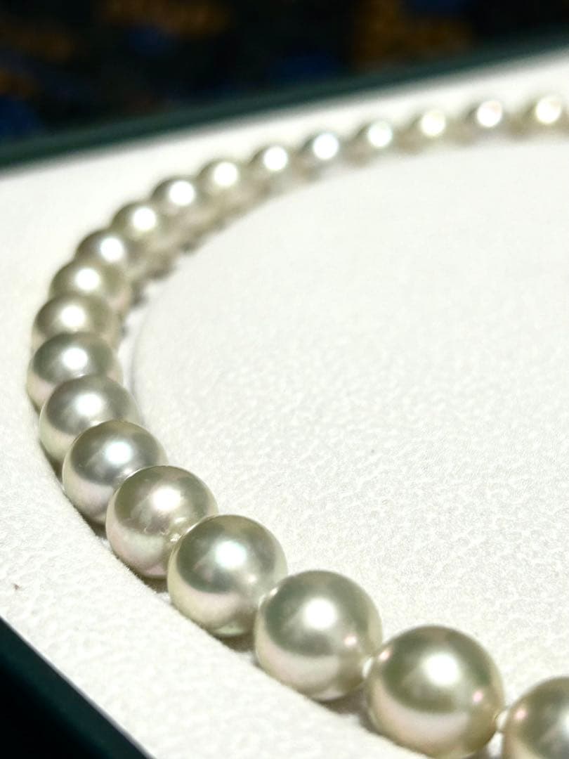 Akoya pearl necklace with 8mm blue-gray beads, silicone cushions, and silver clasp with five blue stones