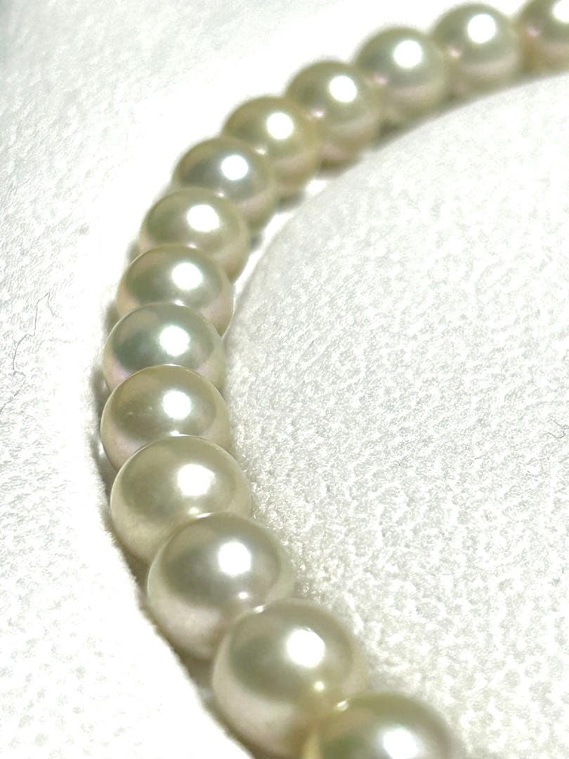 Akoya pearl necklace with 8mm blue-gray beads, silicone cushions, and silver clasp with five blue stones