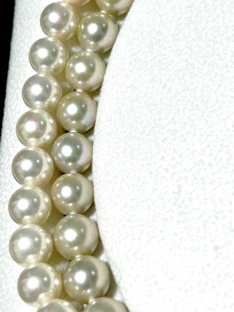 Akoya pearl necklace with 8mm blue-gray beads, silicone cushions, and silver clasp with five blue stones