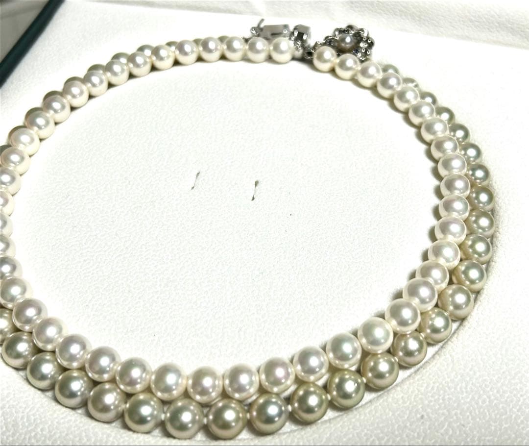 Akoya pearl necklace with 8mm blue-gray beads, silicone cushions, and silver clasp with five blue stones