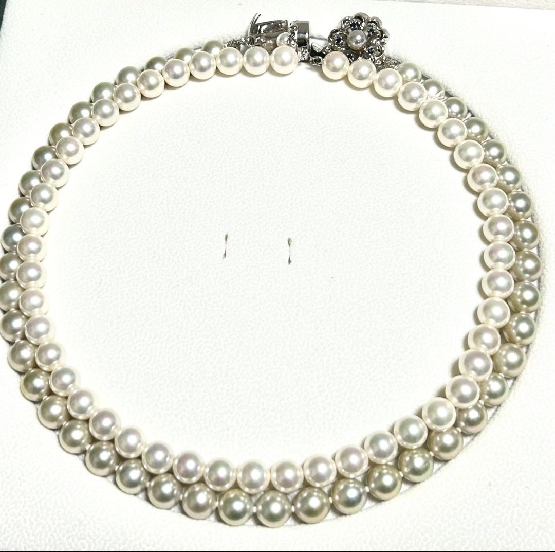 Akoya pearl necklace with 8mm blue-gray beads, silicone cushions, and silver clasp with five blue stones