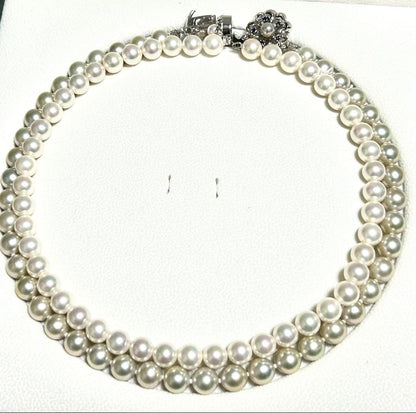 Akoya pearl necklace with 8mm blue-gray beads, silicone cushions, and silver clasp with five blue stones