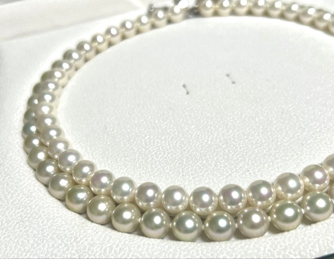 Akoya pearl necklace with 8mm blue-gray beads, silicone cushions, and silver clasp with five blue stones
