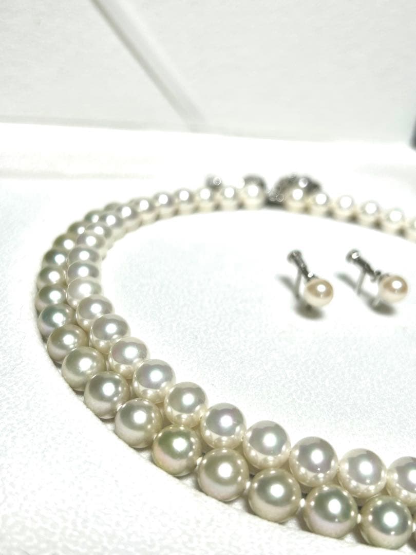 Akoya pearl necklace with 8mm blue-gray beads, silicone cushions, and silver clasp with five blue stones