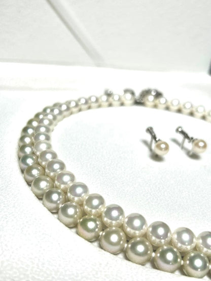 Akoya pearl necklace with 8mm blue-gray beads, silicone cushions, and silver clasp with five blue stones