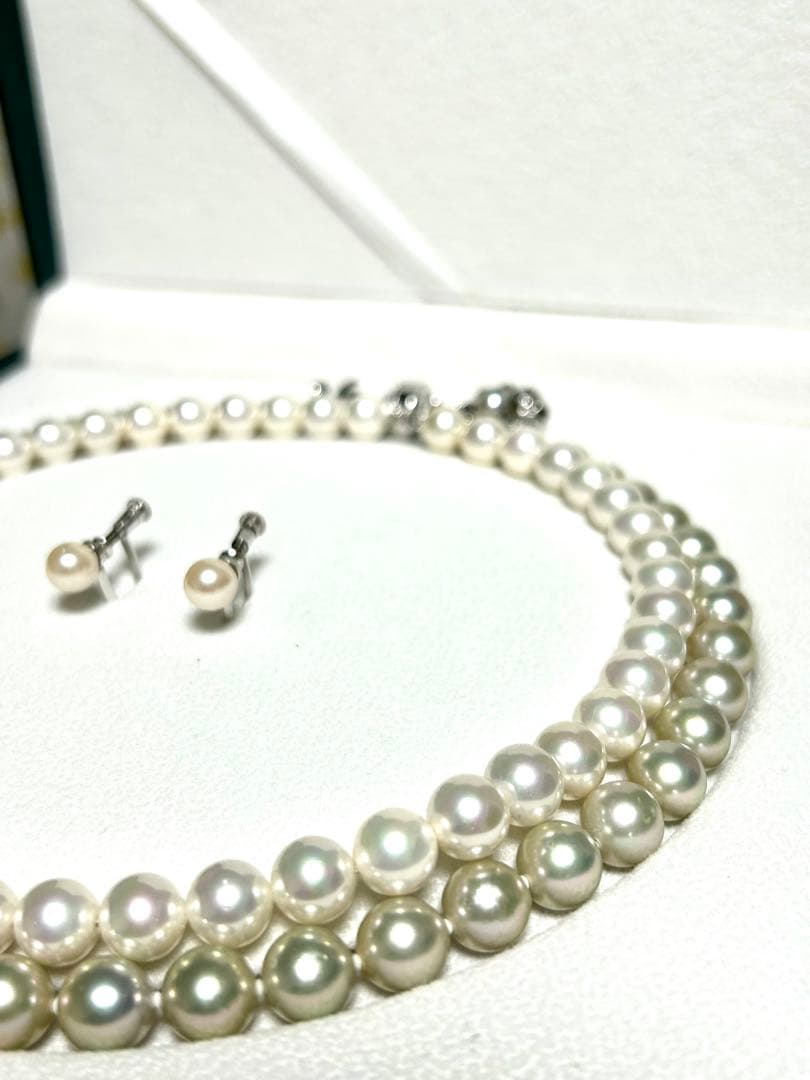 Akoya pearl necklace with 8mm blue-gray beads, silicone cushions, and silver clasp with five blue stones