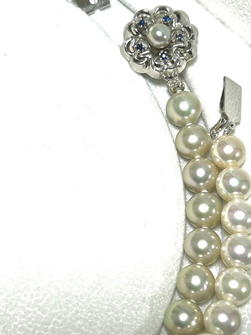Akoya pearl necklace with 8mm blue-gray beads, silicone cushions, and silver clasp with five blue stones