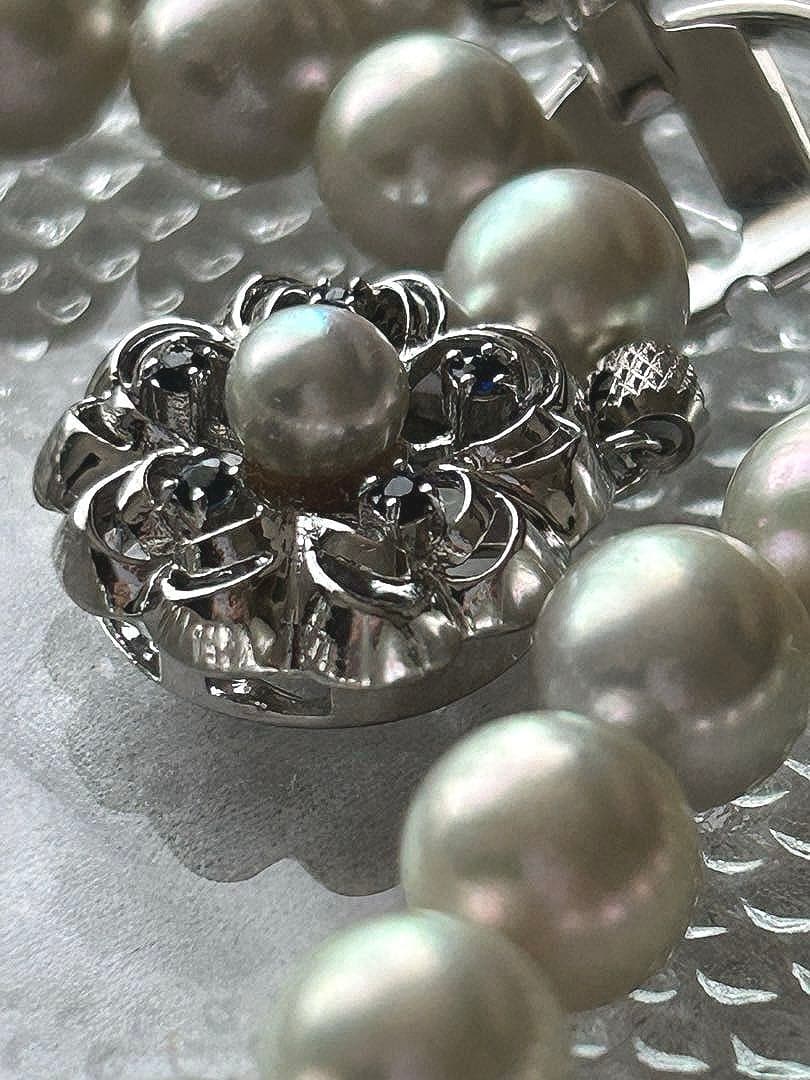 Akoya pearl necklace with 8mm blue-gray beads, silicone cushions, and silver clasp with five blue stones