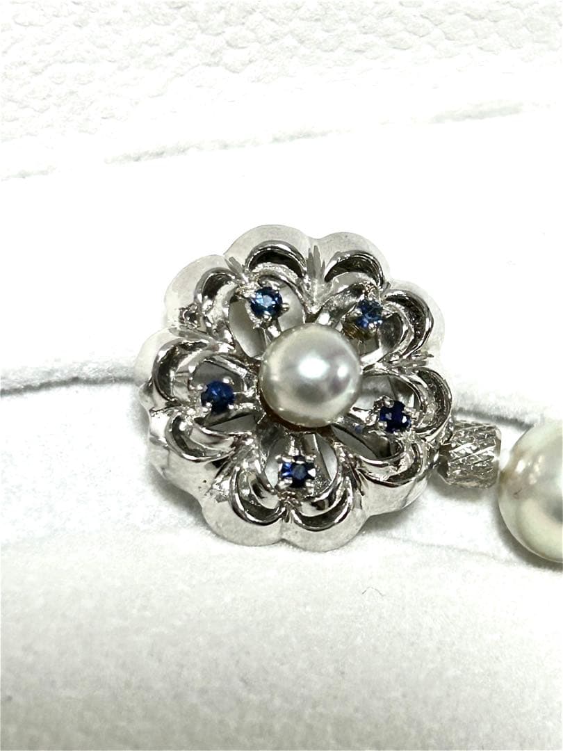 Akoya pearl necklace with 8mm blue-gray beads, silicone cushions, and silver clasp with five blue stones