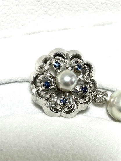 Akoya pearl necklace with 8mm blue-gray beads, silicone cushions, and silver clasp with five blue stones