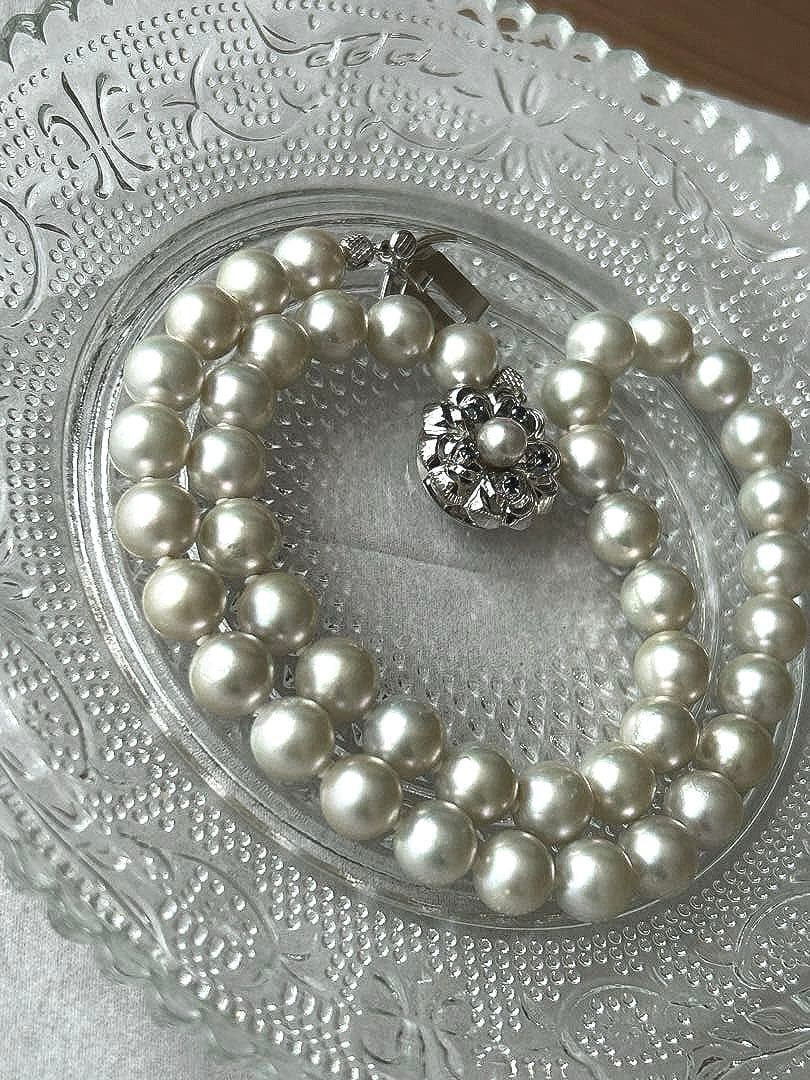 Akoya pearl necklace with 8mm blue-gray beads, silicone cushions, and silver clasp with five blue stones