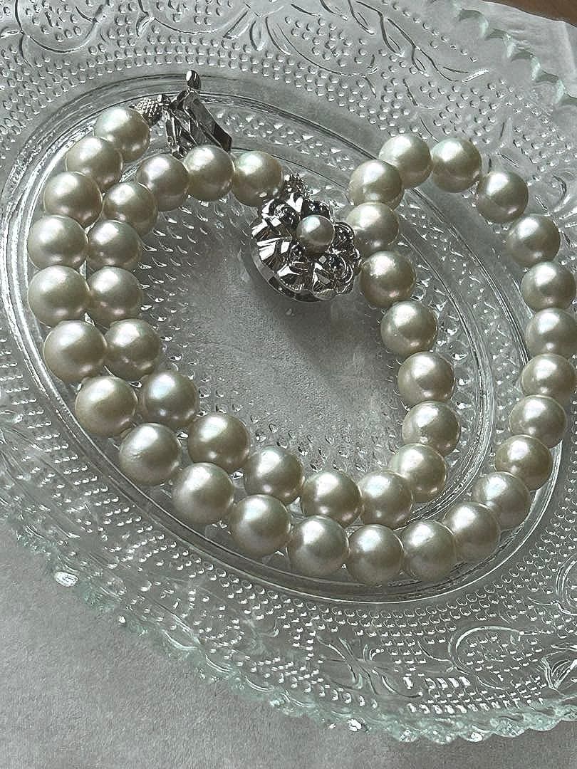 Akoya pearl necklace with 8mm blue-gray beads, silicone cushions, and silver clasp with five blue stones