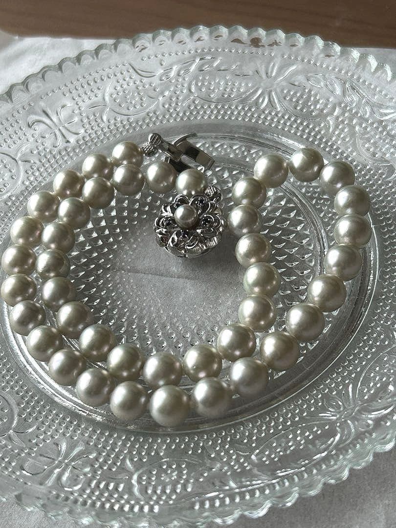 Akoya pearl necklace with 8mm blue-gray beads, silicone cushions, and silver clasp with five blue stones