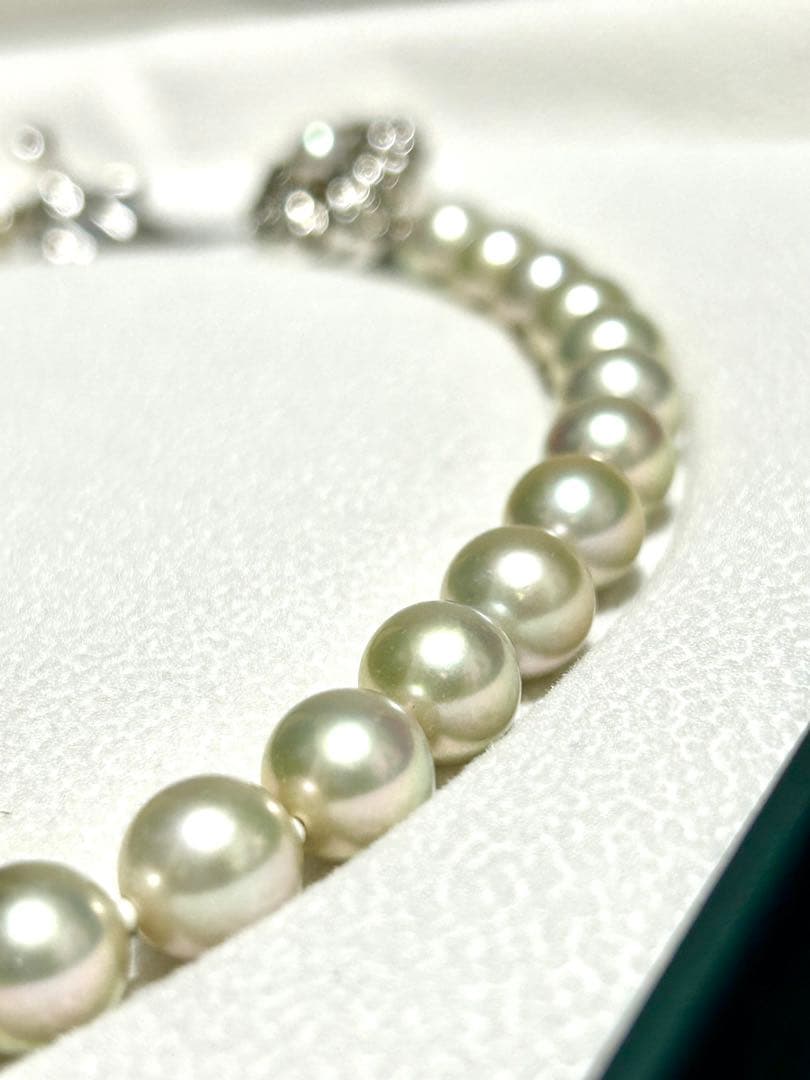 Akoya pearl necklace with 8mm blue-gray beads, silicone cushions, and silver clasp with five blue stones