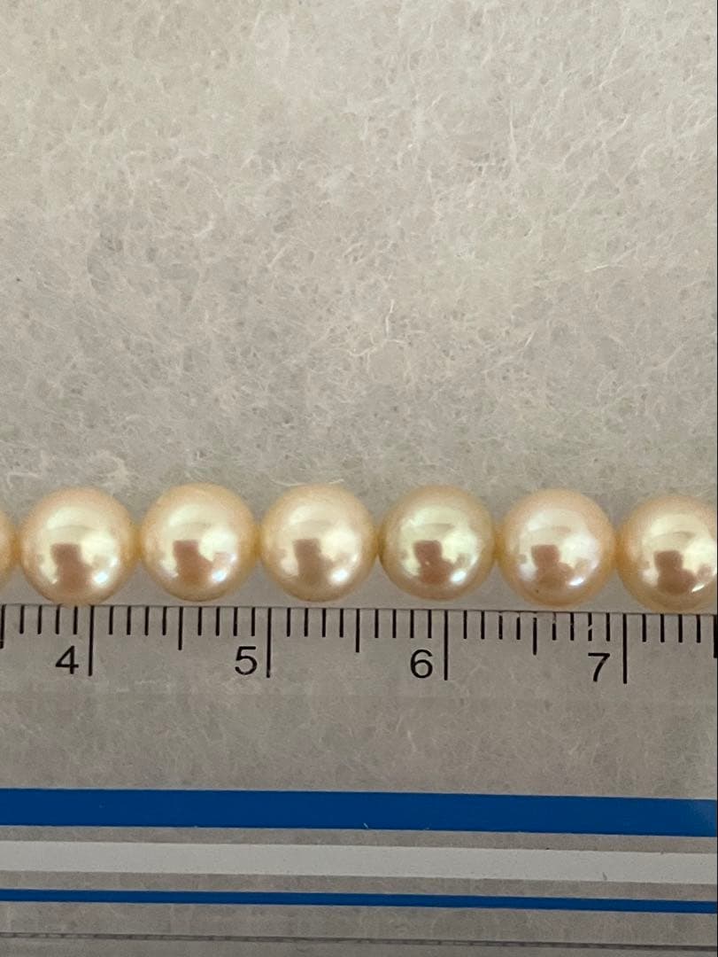 Akoya pearl necklace with 6.5-6.8mm pearls measuring 43.5 cm length on white background