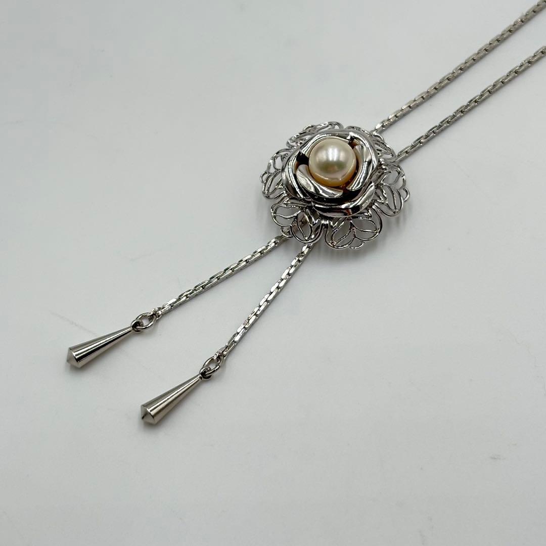 Akoya pearl loop tie necklace with 10mm pearls in silver tone featuring PAT stamp