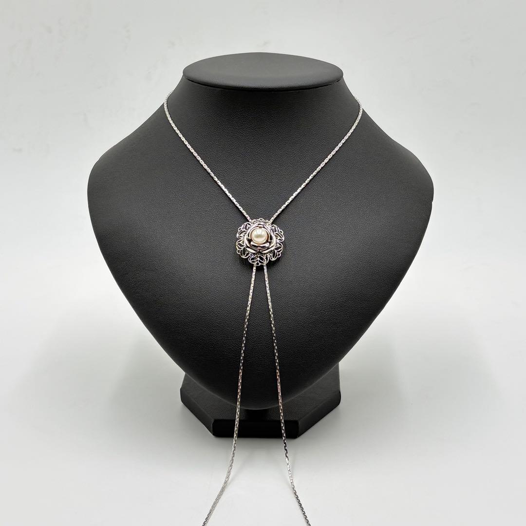 Akoya pearl loop tie necklace with 10mm pearls in silver tone featuring PAT stamp