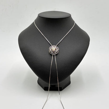 Akoya pearl loop tie necklace with 10mm pearls in silver tone featuring PAT stamp