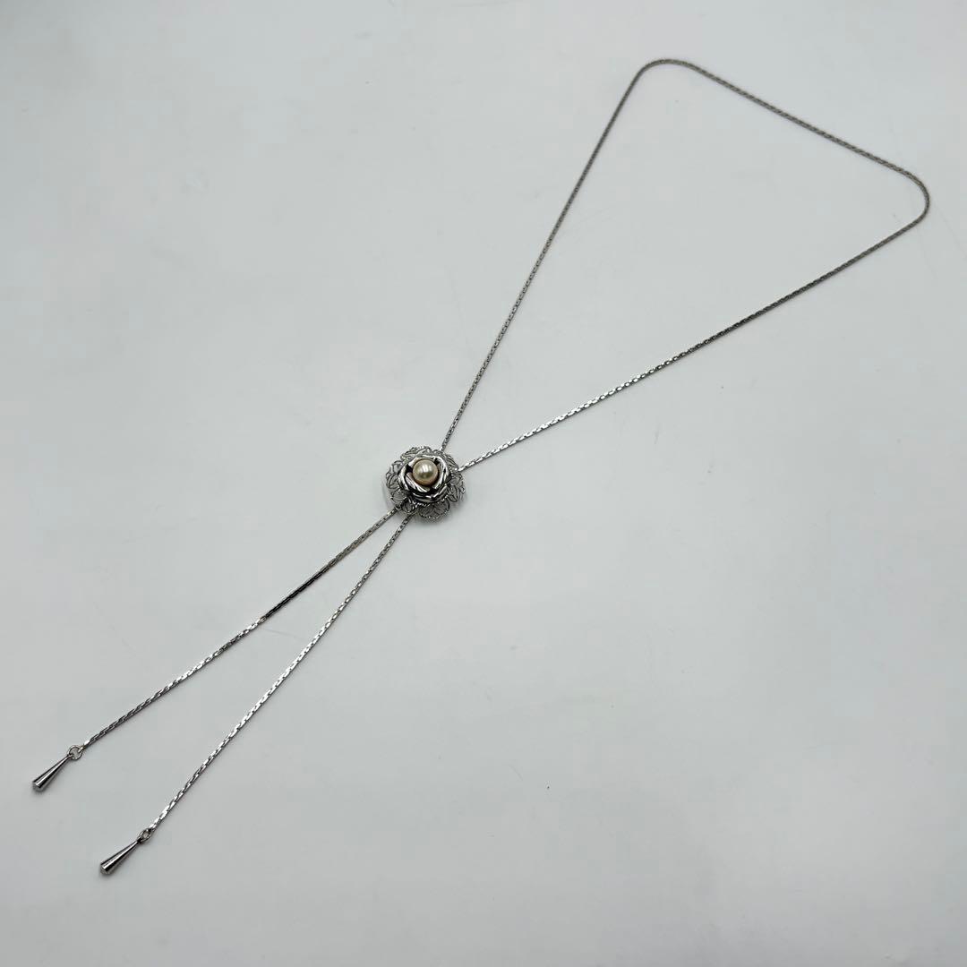 Akoya pearl loop tie necklace with 10mm pearls in silver tone featuring PAT stamp