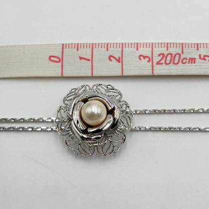 Akoya pearl loop tie necklace with 10mm pearls in silver tone featuring PAT stamp