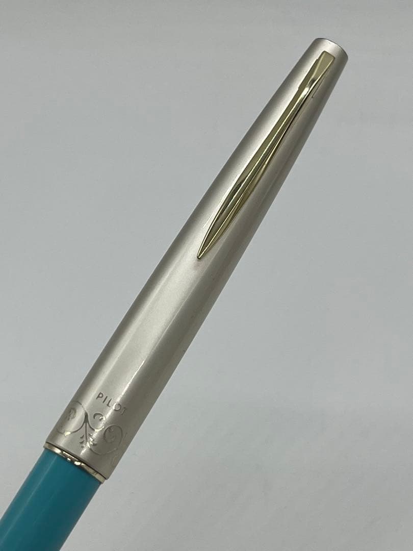 Pilot fountain pen with 14K gold-plated fine nib in turquoise blue and silver etching design