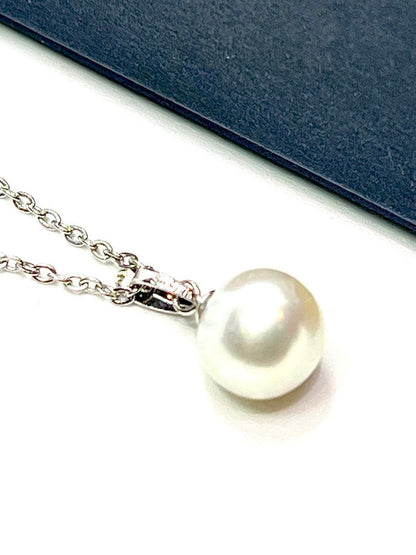 Akoya pearl necklace with 9.8mm large round uncolored pearls and silver stainless steel rhodium chain