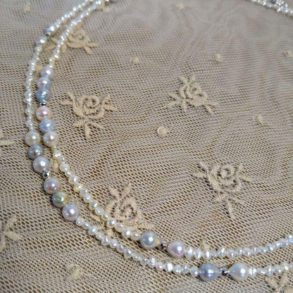 Long necklace with 2.5-3.5mm Akoya Keshi pearls and 5mm natural color Akoya baroque pearls on silver925 chain
