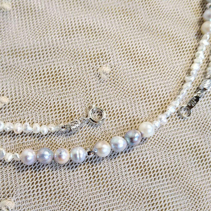 Long necklace with 2.5-3.5mm Akoya Keshi pearls and 5mm natural color Akoya baroque pearls on silver925 chain