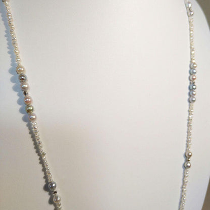 Long necklace with 2.5-3.5mm Akoya Keshi pearls and 5mm natural color Akoya baroque pearls on silver925 chain