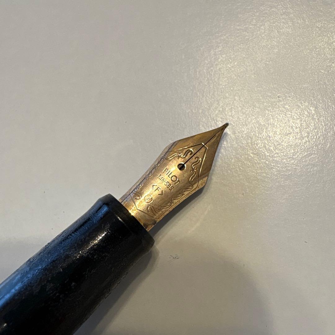 PILOT 14K-585 F vintage fountain pen with gold nib showing retro design and signs of aging