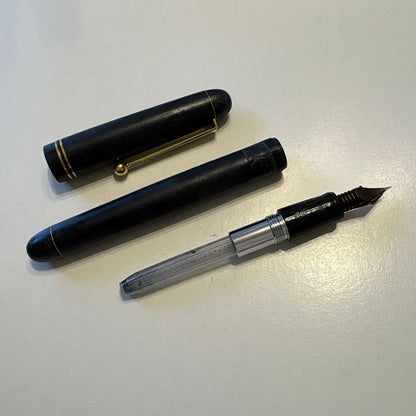 PILOT 14K-585 F vintage fountain pen with gold nib showing retro design and signs of aging