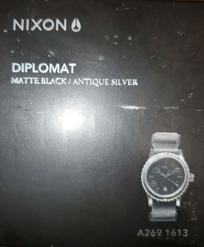NIXON DIPLOMAT BLACK/ANTIQUE SILVER Quartz Men's Watch — Japanese