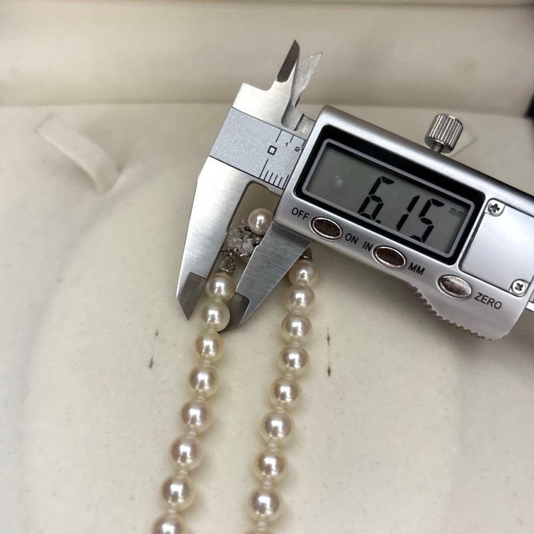 LongAkoya 96cm 2 strand necklace featuring 6.5mm round white Akoya pearls with silver marking