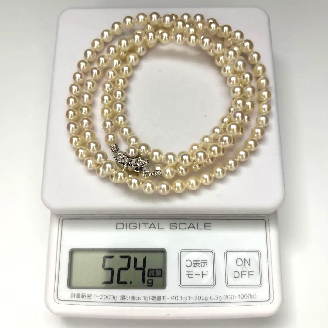 LongAkoya 96cm 2 strand necklace featuring 6.5mm round white Akoya pearls with silver marking