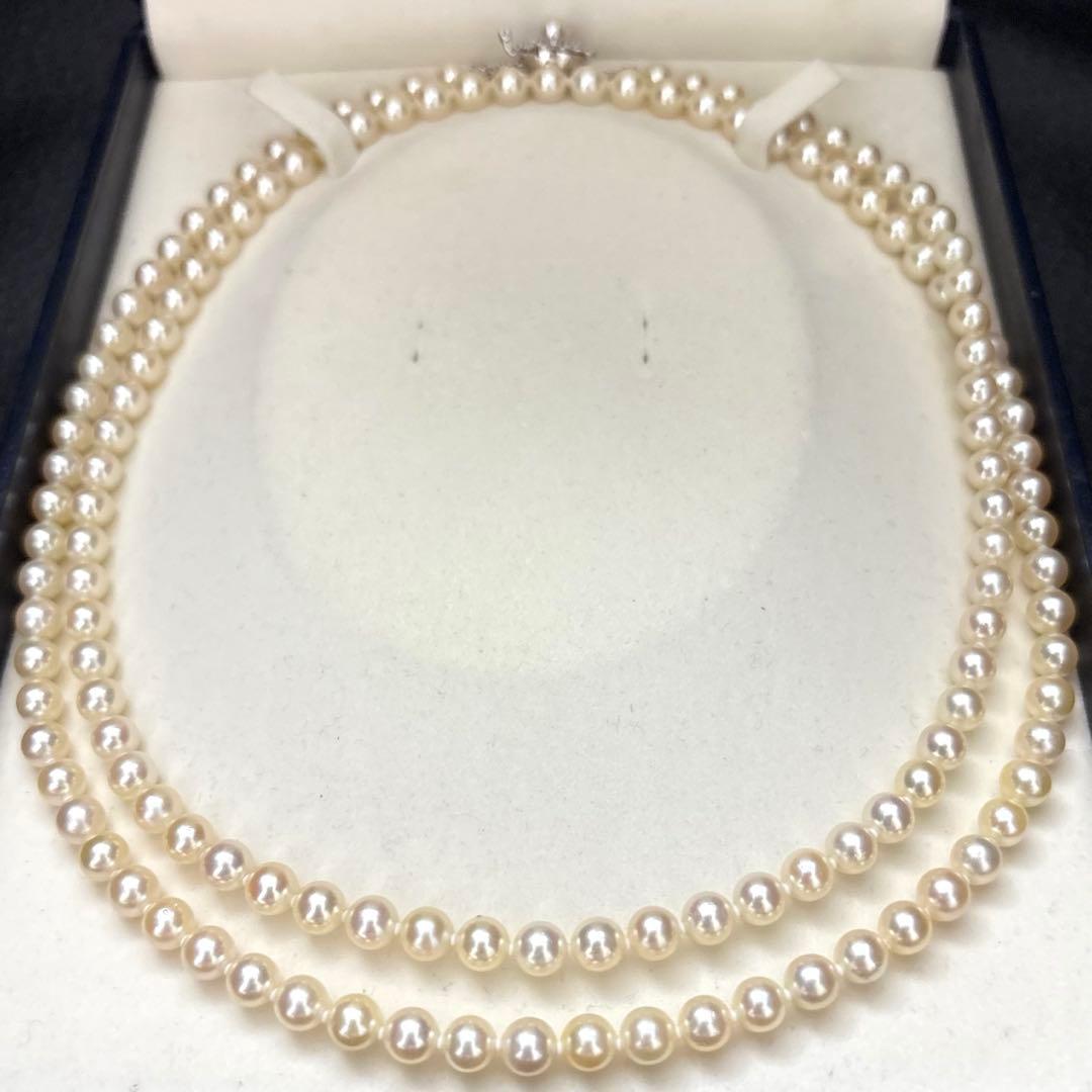 LongAkoya 96cm 2 strand necklace featuring 6.5mm round white Akoya pearls with silver marking