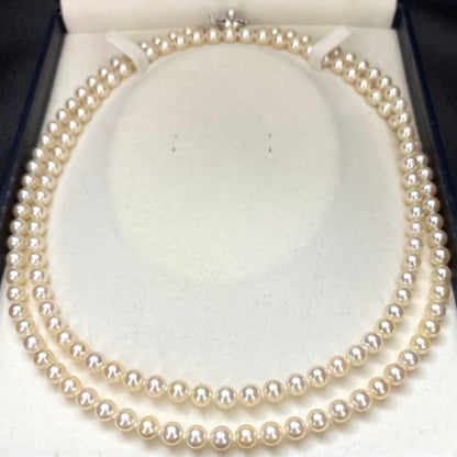 LongAkoya 96cm 2 strand necklace featuring 6.5mm round white Akoya pearls with silver marking