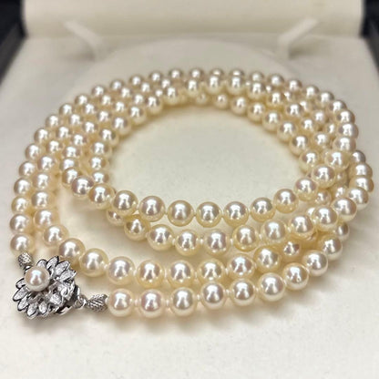 LongAkoya 96cm 2 strand necklace featuring 6.5mm round white Akoya pearls with silver marking